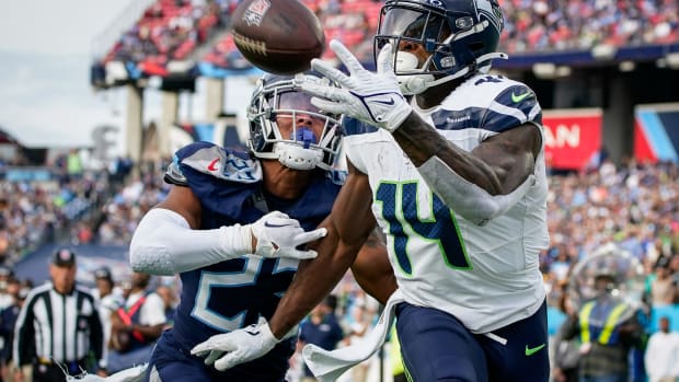 Seattle Seahawks wide receiver DK Metcalf (14) pulls in a touchdown past Tennessee Titans cornerback Tre Avery (23) during the fourth quarter at Nissan Stadium in Nashville, Tenn.,